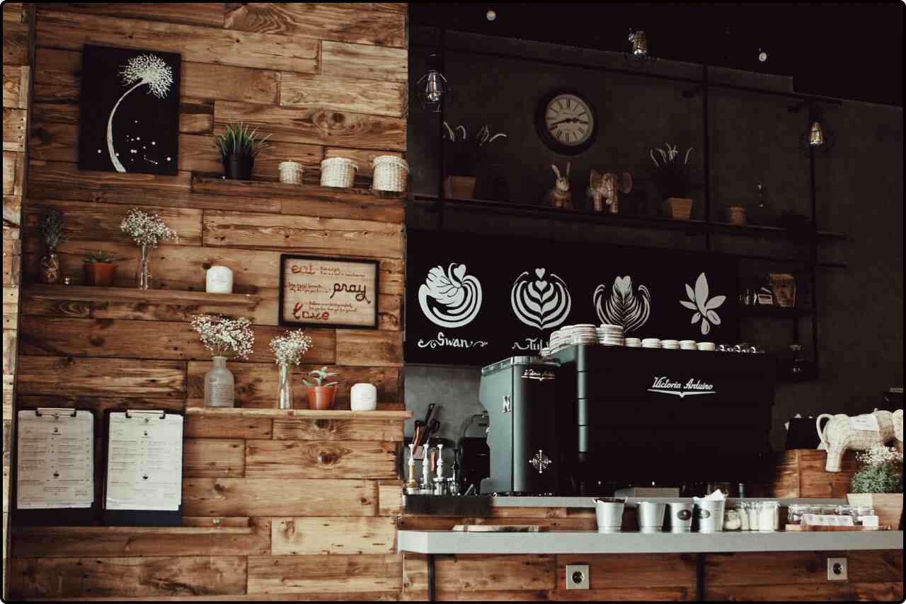 Interior view of a store with a brown rack showcasing different decorations.